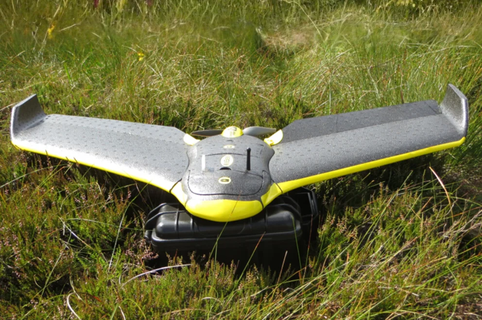 A Sensefly eBee aerial survey drone on a patch of green grass